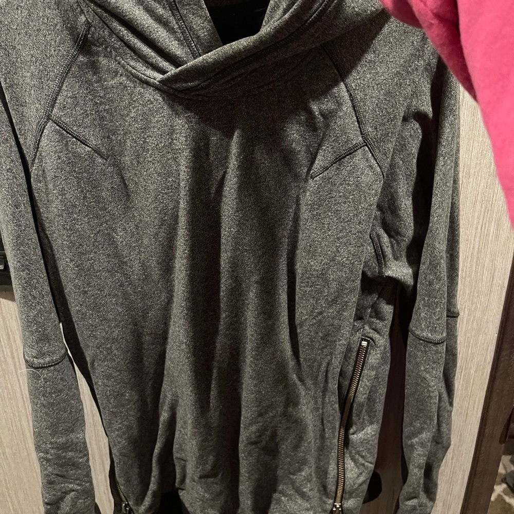 Lululemon size 4 has one tear on the cuff of one of the sleeve easily fixable